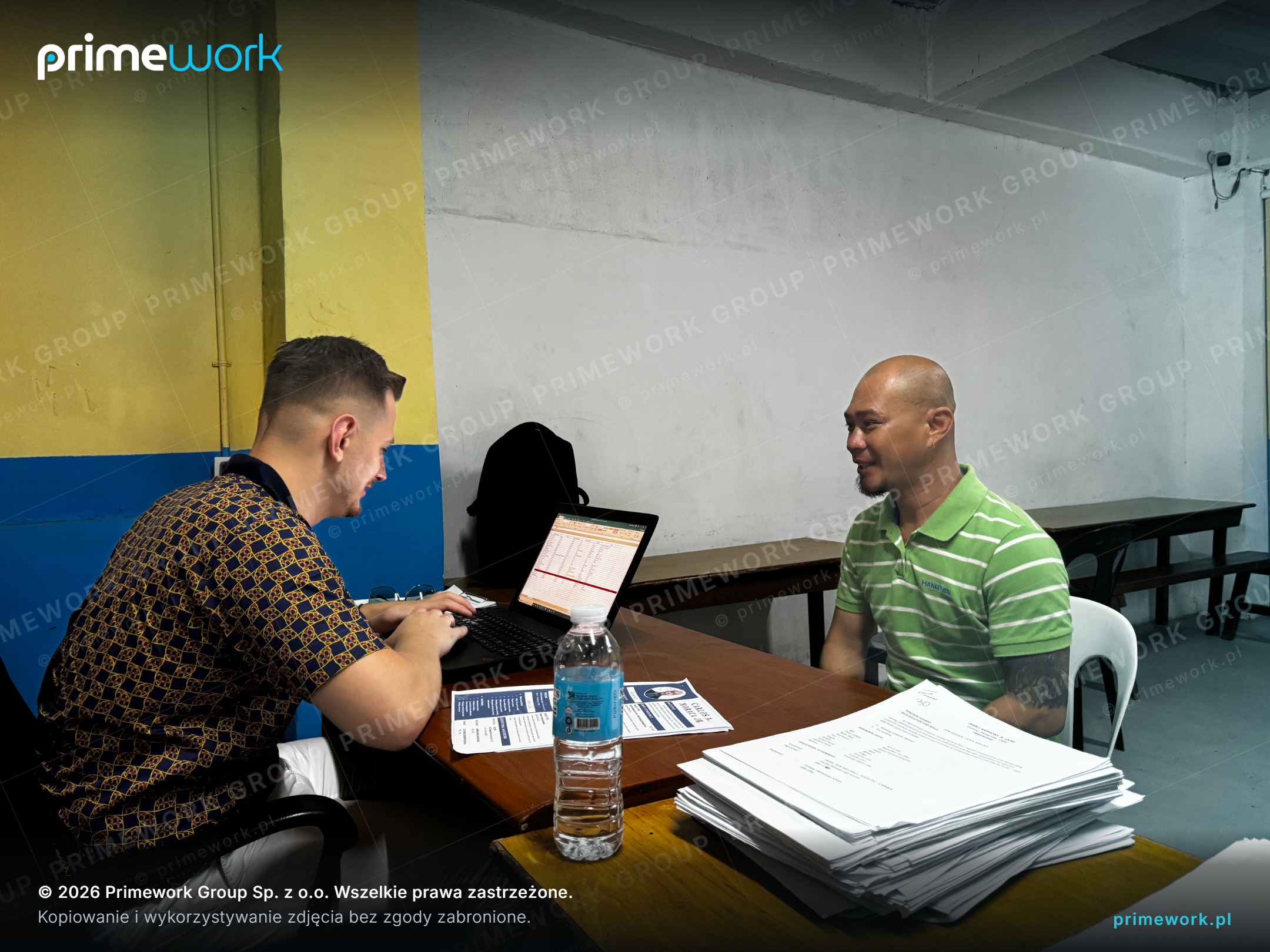 A Primework recruiter conducting a job interview with a candidate at a laptop