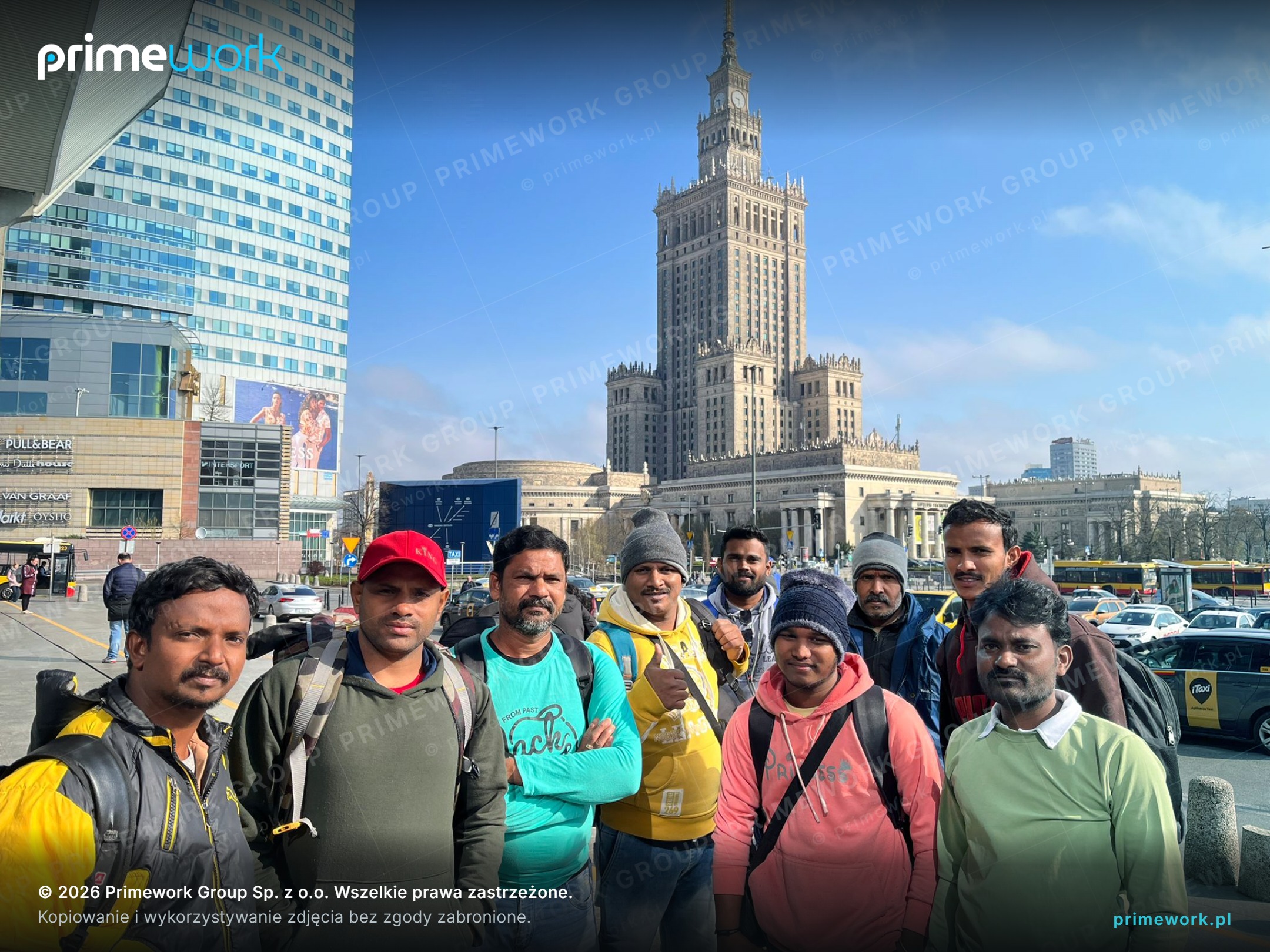 A team of workers from India with backpacks after arrival